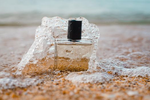 A bottle of perfume on the background of the sea . Men's perfume. Smell. Copy Space