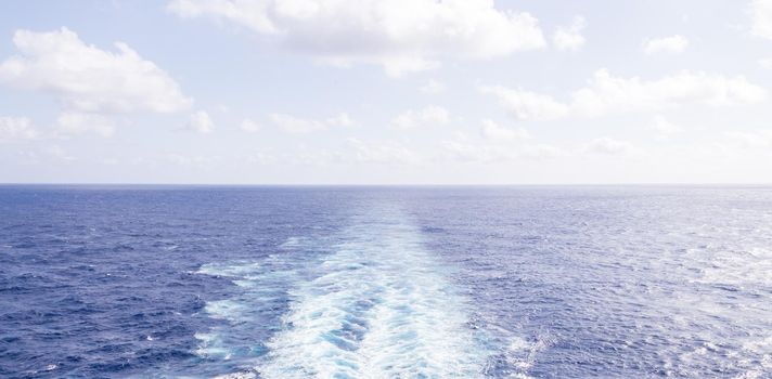 Cruise ship wake or trail on ocean surface, white trace