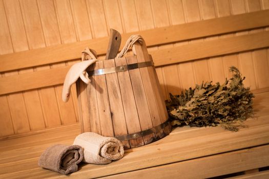 Inside view of traditional sauna with some equipment