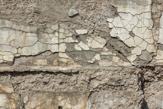 cracked white concrete wall under direct sun light full frame background and texture.