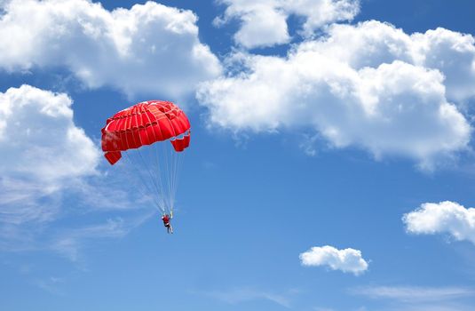 Parachuting over a sea, towing by a boat