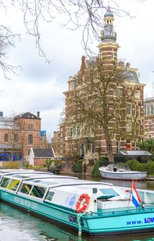 AMSTERDAM, NETHERLANDS - MARCH 15: Streets of the city with canals, on March 15, 2014 in Amsterdam