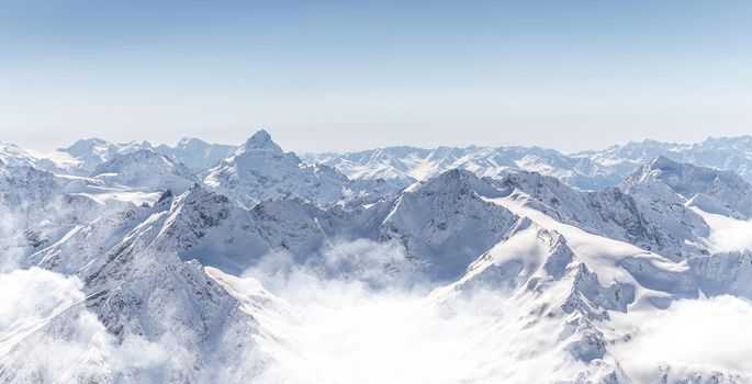 Panorama of winter mountains in Caucasus region, Russia, view from Elbrus mountain