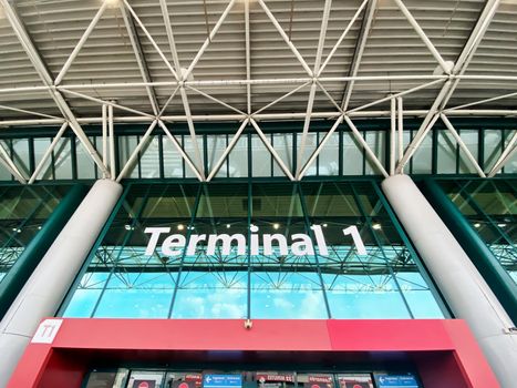 Rome, Italy, August 2021: The main entrance to Terminal 1 for departures at Leonardo Da Vinci international airport in Rome. Modern airport building. Travel and transportation