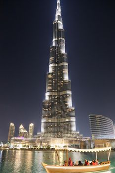 DUBAI, UNITED ARAB EMIRATES – JANUARY 20: Tower Burj Khalifa vanishing in blue sky on January 20, 2014 in Dubai. It is the tallest structure in world since 2010, 829.8 meters and one of the most visited tourist attractions in the world.