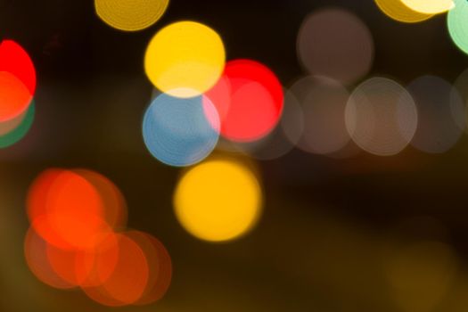 Beautiful background of bokeh lights at night on road with cars