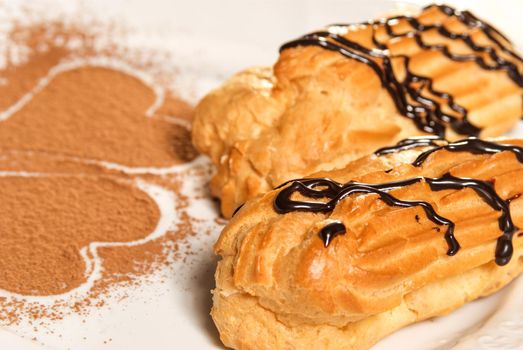 Mini vanilla eclairs with chocolate frosting