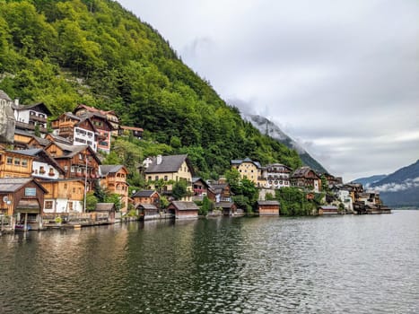 Hallstatt Austria city at lake and mountains panorama with cloudy sky