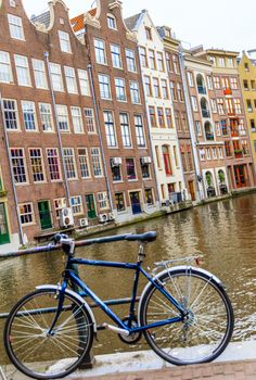 AMSTERDAM, NETHERLANDS - MARCH 15: Streets of the city with canals, on March 15, 2014 in Amsterdam