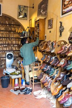 FLORENCE, ITALY, MAY 04, 2018: Fashion classical polished men's handmade shoes selling in shop in Florence Italy