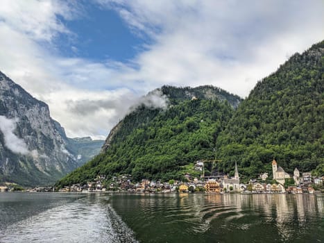 Hallstatt Austria city at lake and mountains panorama from the lake
