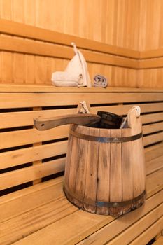 Inside view of traditional sauna with some equipment