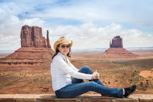 Young woman wearing straw hat in Monumet Valley