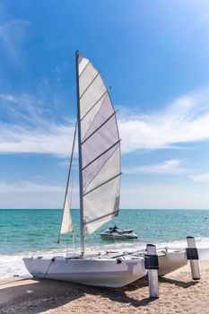 A sunny, breezy sea is perfect for a catamaran sail