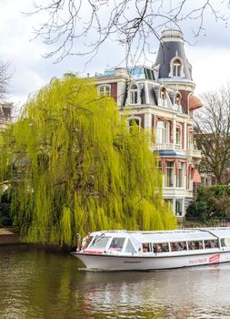 AMSTERDAM, NETHERLANDS - MARCH 15: Streets of the city with canals, on March 15, 2014 in Amsterdam