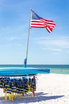 ST.PETE BEACH, FLORIDA, USA - SEPTEMBER 03, 2014: Life jackets and boats on St.Pete beach in Florida, on September, 2014, USA.