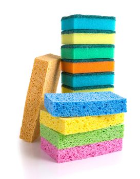 Stack of colorful cleaning sponges isolated on white background