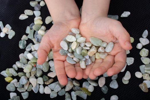 Handful of  clean pebbles, gravels in hands