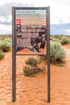 PAGE, ARIZONA - MAY 25: Hikers at Horseshoe Bend on May 25, 2015 in Page AZ,USA. Thousands of people from all over the world visit this unique place every year.