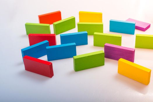 Colorful Domino Blocks placed on a white background