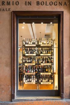 BOLOGNA, ITALY - MAY 01, 2018: Winery shop. Wine store shelves inside wine shop in Bologna