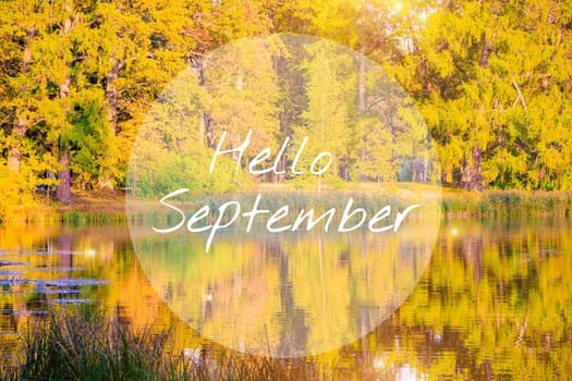 Hello September banner with a landscape . Autumn park landscape. A new season. A greeting card. Landscape with text. Autumn landscape with the text hello autumn.