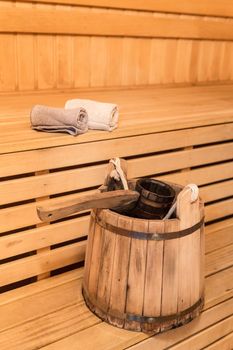 Inside view of traditional sauna with some equipment