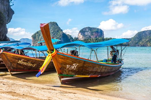 PHANG NGA BAY, THAILAND 10 JANUARY, 2018: Long Tail Boat, traditional wooden boats, in James Bond island, Khao Phing Kan, Phang Nga Bay, Ao Phang Nga National Park, Krabi Province, Thailand