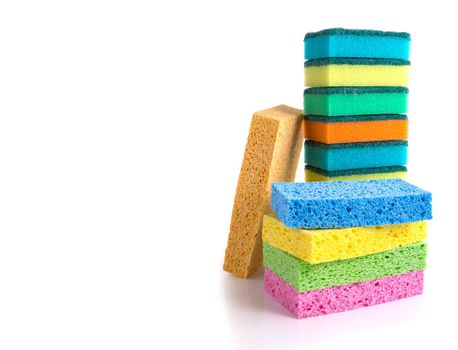 Stack of colorful cleaning sponges isolated on white background