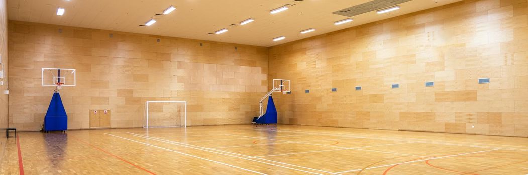 Interior of empty modern basketball or soccer indoor sport gymnasium