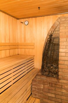 interior of a sauna with big stone oven