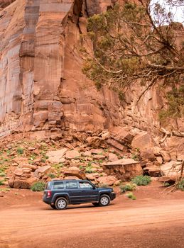 MONUMENT VALLEY, UTAH, USA - MAY 25, 2015 - Offroading through the Monument Valley in a Jeep Patriot. Jeep Patriot is a four-wheel drive off-road and sport utility vehicle (SUV), manufactured by American automaker Chrysler.