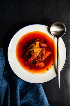 Traditional ukrainian beet soup red borscht on wooden table