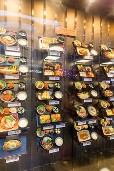 PHUKET, THAILAND - JANUARY 11, 2018: Japanese restaurant with plastic food display in Thailand. Artificial food display in restaurant windows is an important element of Japanese culture