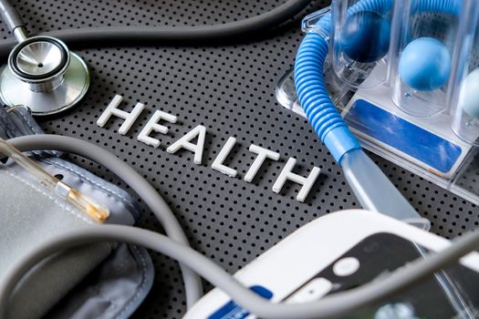 Concept image of Health background, health letters and medical equipment on gray background.