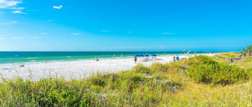 Florida, USA - September 17, 2019: Indian rocks beach with green grass in Florida USA