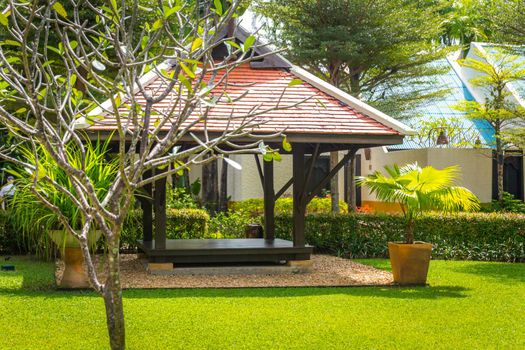 beautiful wooden gazebo in tropical nature