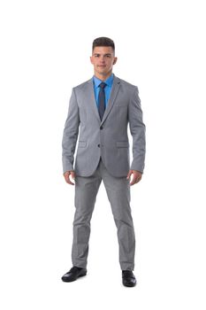 Full body portrait of young business man in gray suit isolated on white background