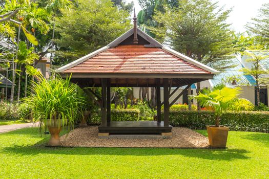 beautiful wooden gazebo in tropical nature