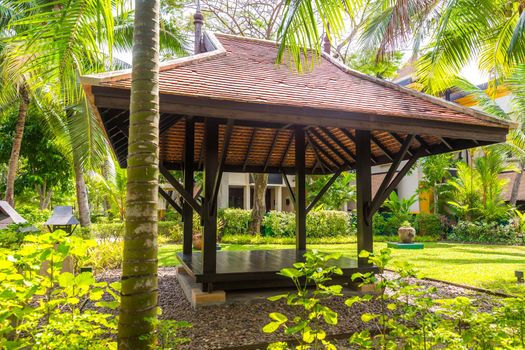 beautiful wooden gazebo in tropical nature