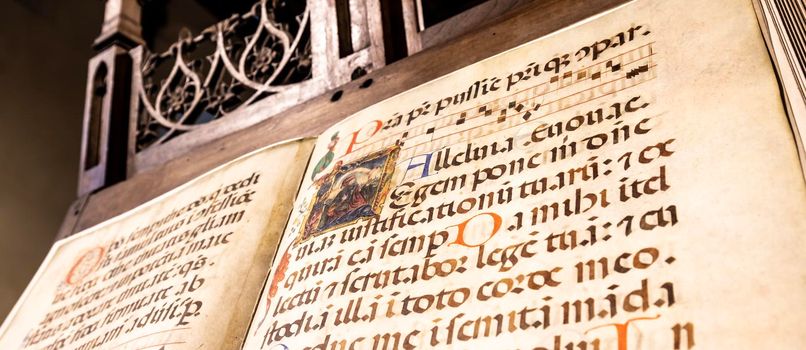 TURIN, ITALY - CIRCA MAY 2021: antique Medieval manuscript with ancient calligraphy.