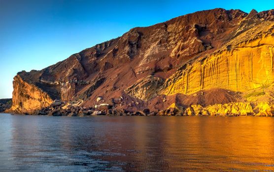 View of the Linosa volcano called Monte Nero in the beach of Cala Pozzolana di Ponente, Sicily