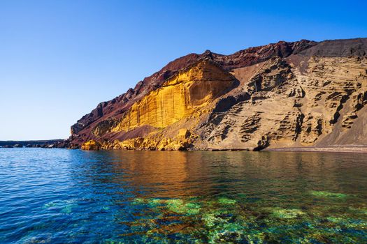 View of the Linosa volcano called Monte Nero in the beach of Cala Pozzolana di Ponente, Sicily