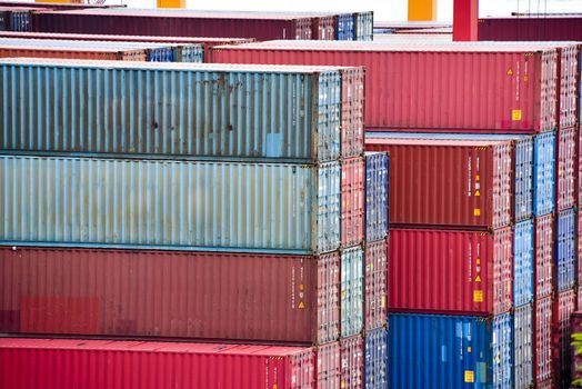 Freight shipping. Dozens of cargo containers stacked in a shipping yard