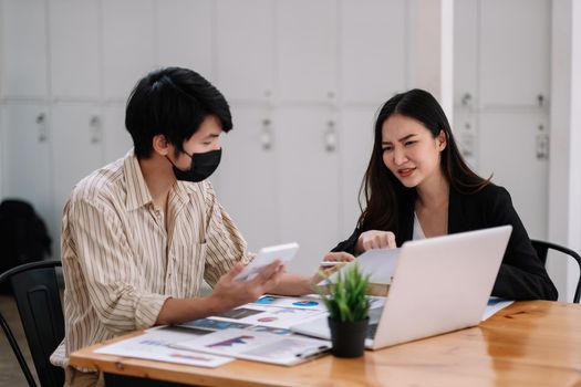 Close up asian business adviser meeting to analyze and discuss the situation on the financial report in the meeting room.Investment Consultant,Financial advisor and accounting concept.