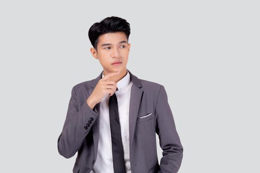 Portrait young asian business man in suit with smart thinking idea isolated on white background, businessman standing and planning for success, handsome manager or executive, emotion and expression.