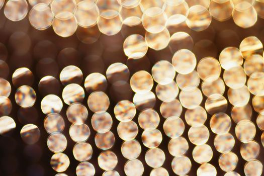 Golden particles as luxury abstract background.