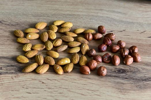 Almonds lying on the table by the handful.