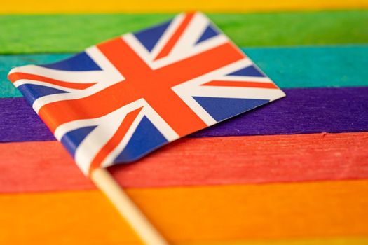 United Kingdom flag on rainbow background symbol of LGBT gay pride month social movement rainbow flag is a symbol of lesbian, gay, bisexual, transgender, human rights, tolerance and peace.
