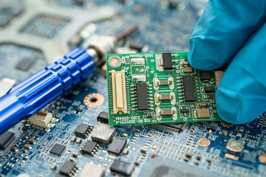 Repairing inside of hard disk by soldering iron. Integrated Circuit. the concept of data, hardware, technician and technology.